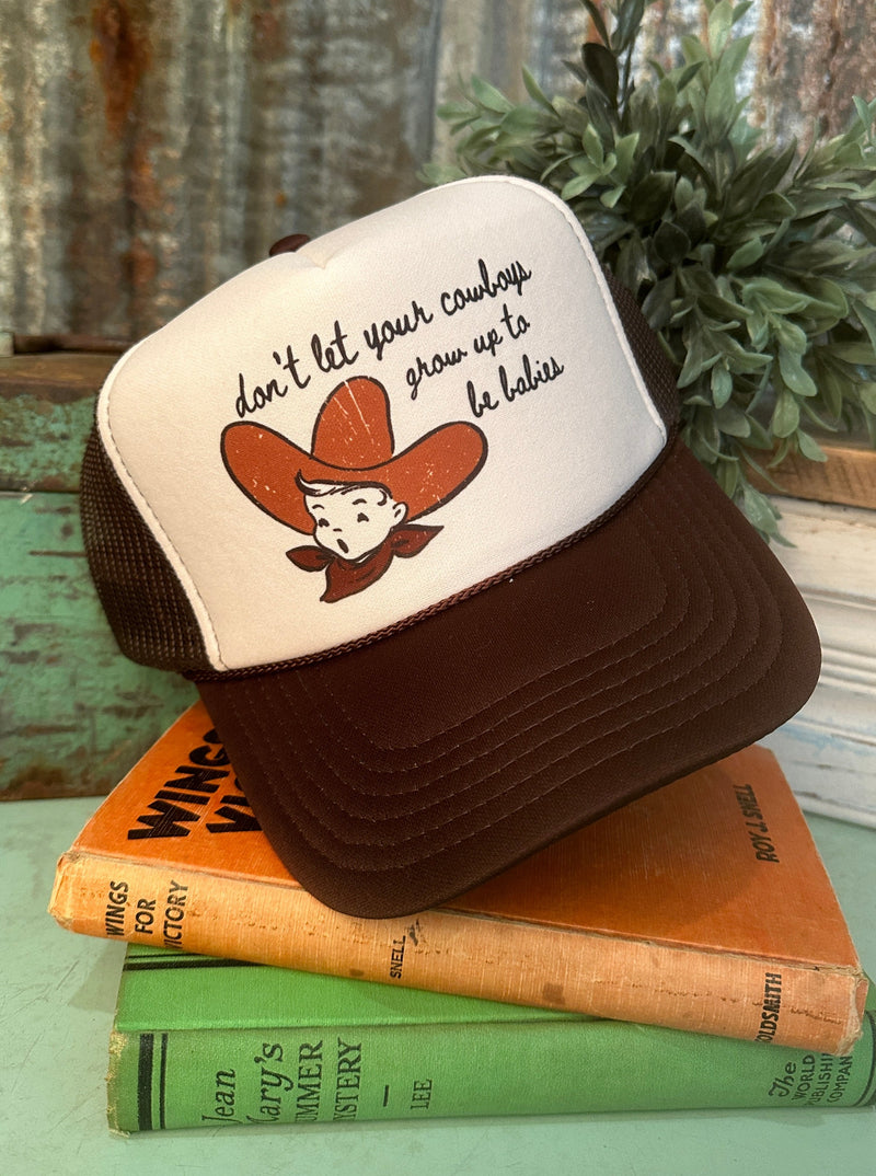 don't let your cowboys grow up to be babies Trucker Hat in brown