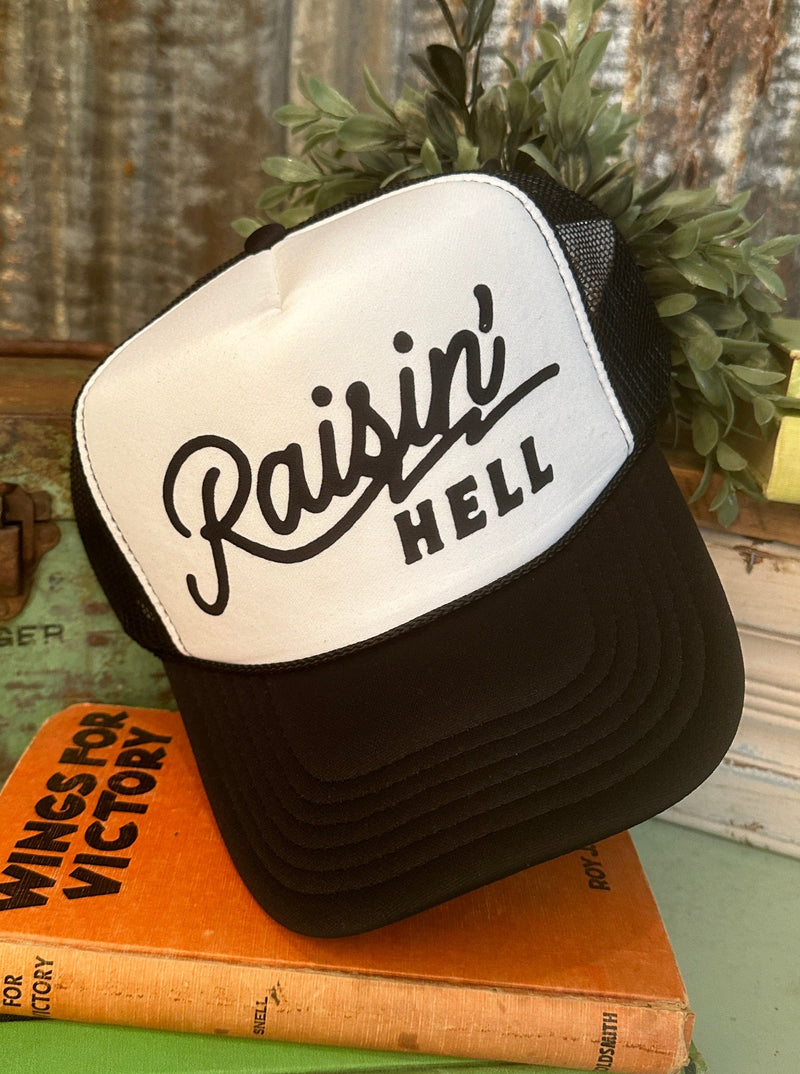Raisin' Hell Trucker Hat in Black